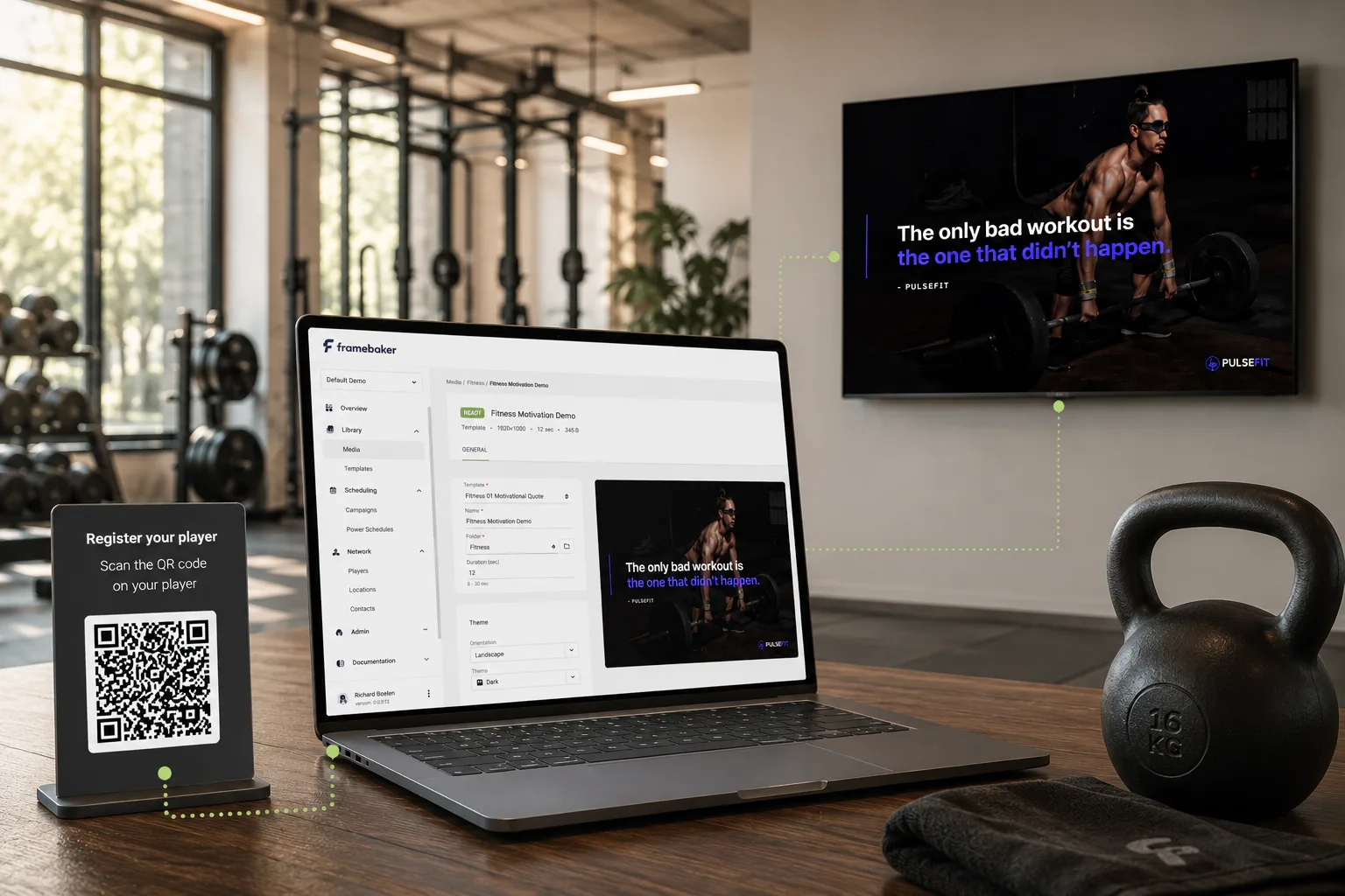 Framebaker CMS on laptop with studio screen showing content in the background